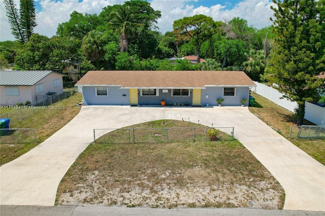 14320 NE 18th Ave, Miami, FL 33181 - ranch-style home featuring driveway, fence private yard, a front yard, and stucco siding