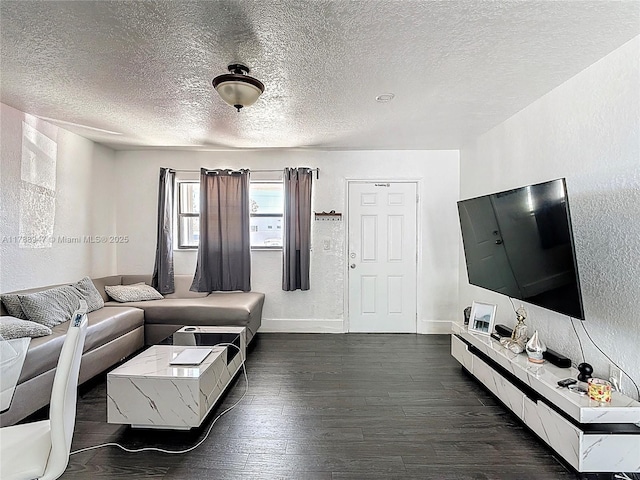 14320 NE 18th Ave, Miami, FL 33181 - living room featuring baseboards, a textured wall, dark wood-style flooring, and a textured ceiling