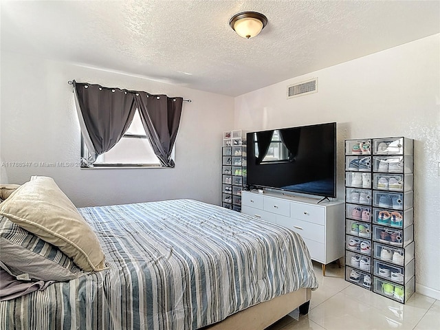 14320 NE 18th Ave, Miami, FL 33181 - bedroom featuring a textured ceiling, visible vents, and light tile patterned floors