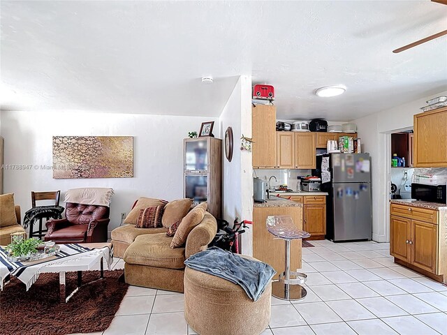 14320 NE 18th Ave, Miami, FL 33181 - living room featuring light tile patterned floors and ceiling fan
