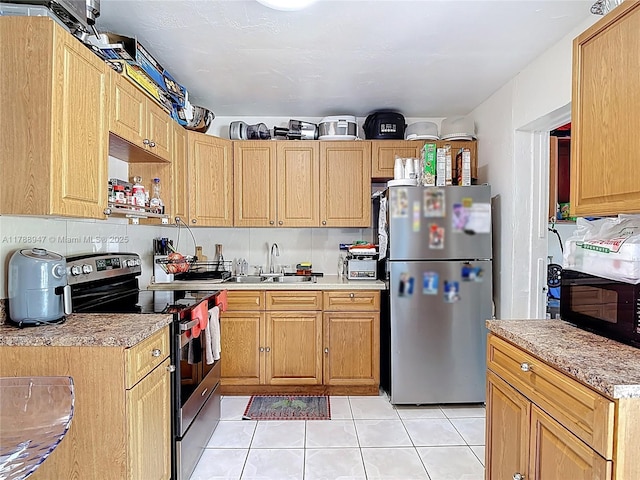 14320 NE 18th Ave, Miami, FL 33181 - kitchen with light countertops, light tile patterned flooring, appliances with stainless steel finishes, and a sink