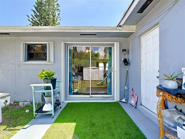14320 NE 18th Ave, Miami, FL 33181 - entrance to property with a lawn and stucco siding
