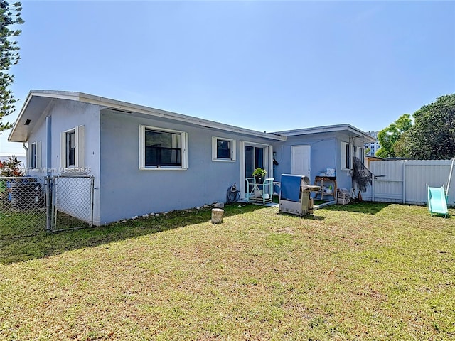 14320 NE 18th Ave, Miami, FL 33181 - back of property with fence, stucco siding, and a yard