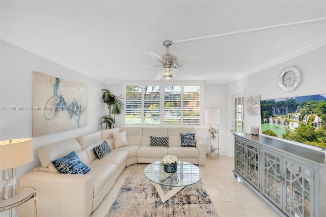 living area with a ceiling fan, ornamental molding, and light tile patterned flooring