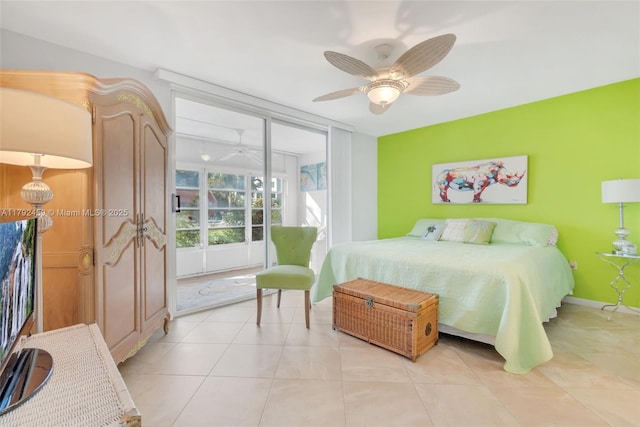 bedroom with a ceiling fan, light tile patterned floors, and access to exterior