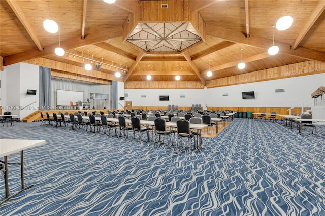 misc room with visible vents, beamed ceiling, high vaulted ceiling, wooden ceiling, and carpet flooring