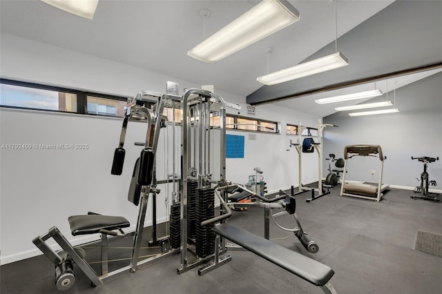 gym with baseboards and a healthy amount of sunlight