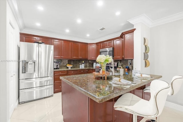 1820 Vista Way, Margate, FL 33063 - kitchen with crown molding, tasteful backsplash, a peninsula, dark stone counters, and stainless steel appliances