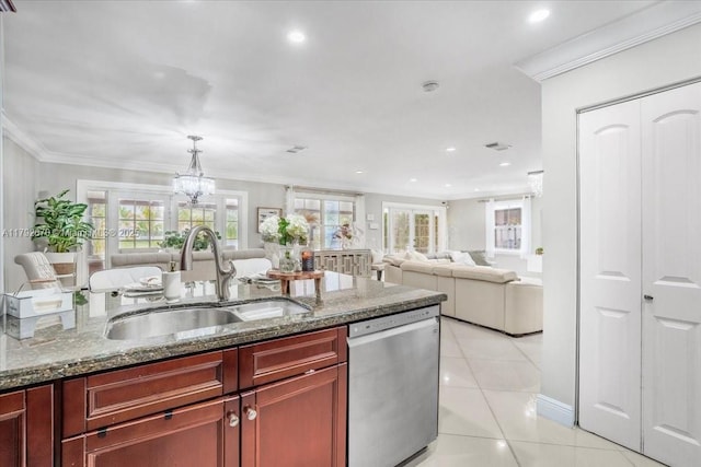 1820 Vista Way, Margate, FL 33063 - kitchen featuring stainless steel dishwasher, a healthy amount of sunlight, reddish brown cabinets, a sink, and light tile patterned floors