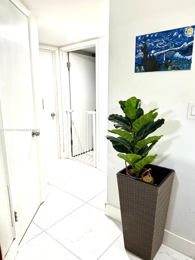 1401 NE 191st St Unit D201, Miami, FL 33179 - corridor featuring baseboards and marble finish floor
