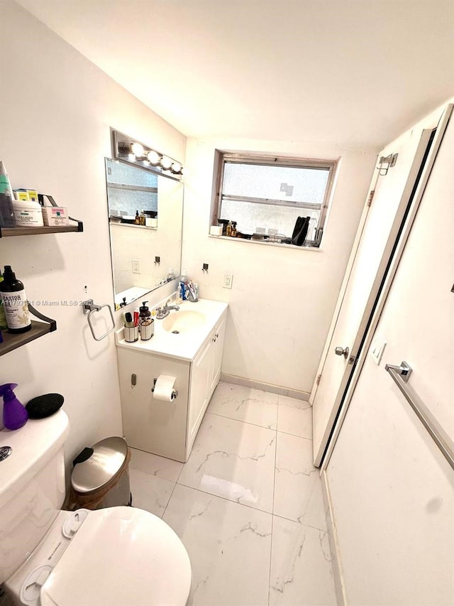 1401 NE 191st St Unit D201, Miami, FL 33179 - bathroom featuring toilet, marble finish floor, and vanity