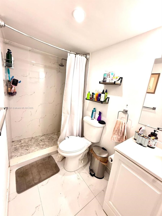 1401 NE 191st St Unit D201, Miami, FL 33179 - full bath with vanity, a stall shower, toilet, and marble finish floor