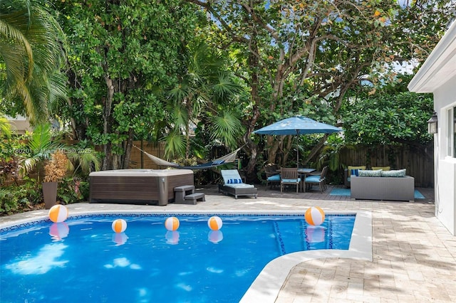 view of pool with a patio, central AC, a fenced in pool, and a fenced backyard