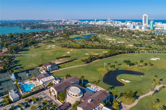 aerial view with a water view, view of golf course, and a city view
