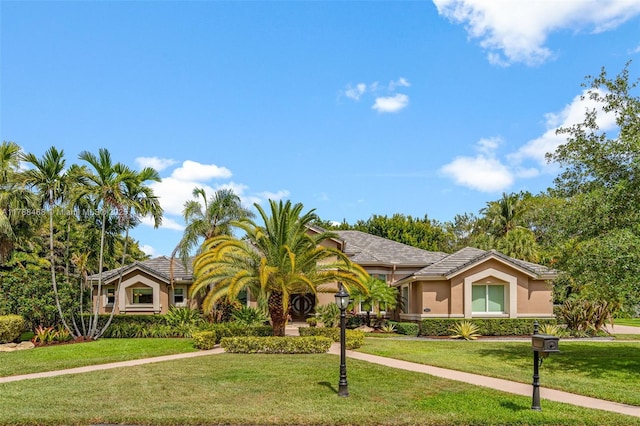 10605 Indian Trl, Cooper City, FL 33328 - view of front of home featuring stucco siding and a front yard