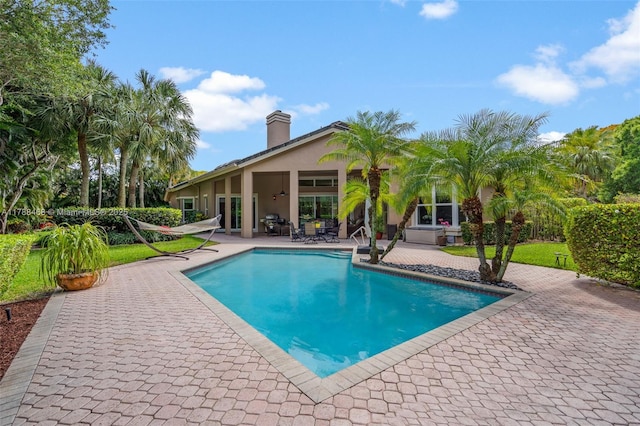 10605 Indian Trl, Cooper City, FL 33328 - outdoor pool featuring a patio area