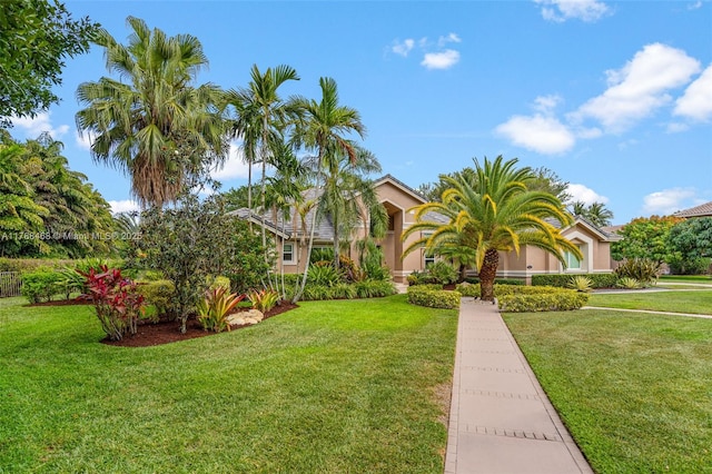 10605 Indian Trl, Cooper City, FL 33328 - mediterranean / spanish-style home with a front lawn and stucco siding