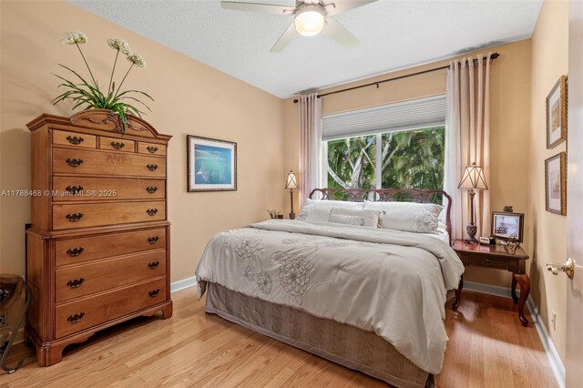 10605 Indian Trl, Cooper City, FL 33328 - bedroom with baseboards, a ceiling fan, and light wood-style flooring