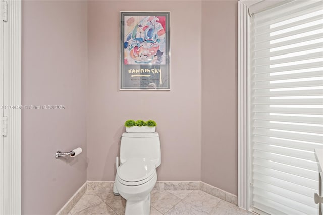 10605 Indian Trl, Cooper City, FL 33328 - bathroom with toilet, baseboards, and tile patterned flooring