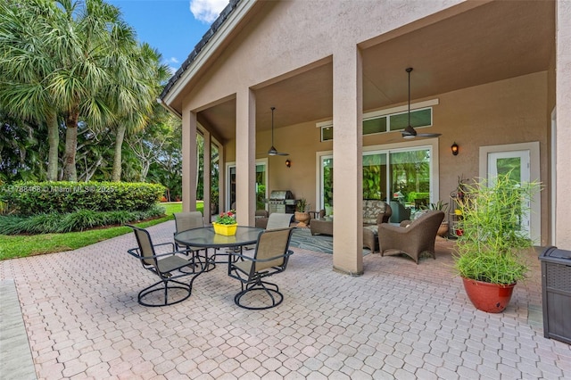10605 Indian Trl, Cooper City, FL 33328 - view of patio / terrace featuring exterior kitchen, ceiling fan, outdoor lounge area, and outdoor dining area
