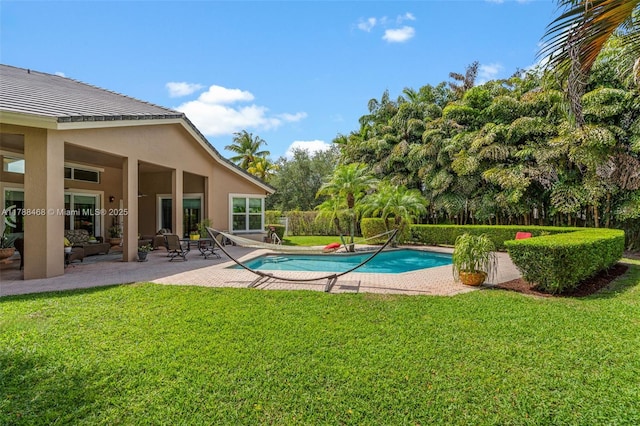 10605 Indian Trl, Cooper City, FL 33328 - view of pool with a lawn, a fenced in pool, and a patio