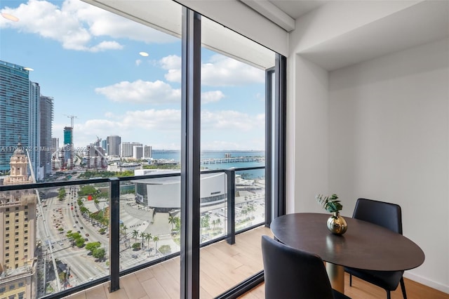 398 NE 5th St Unit 1805, Miami, FL 33132 - dining room with a view of city, a water view, and wood finished floors