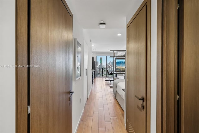 398 NE 5th St Unit 1805, Miami, FL 33132 - hall with light wood-style floors and baseboards
