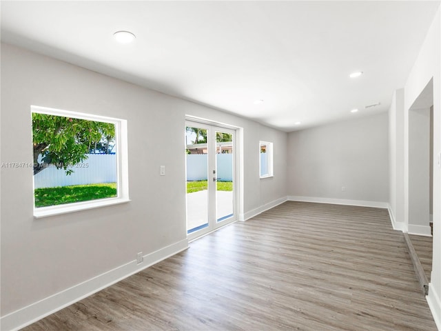 5397 W 14th Ct, Hialeah, FL 33012 - kitchen with light countertops, stainless steel appliances, a sink, and wood finished floors
