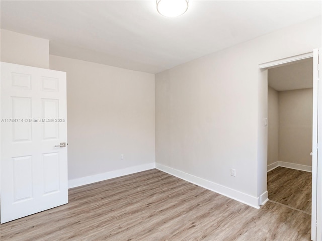 5397 W 14th Ct, Hialeah, FL 33012 - spare room featuring recessed lighting, baseboards, and wood finished floors