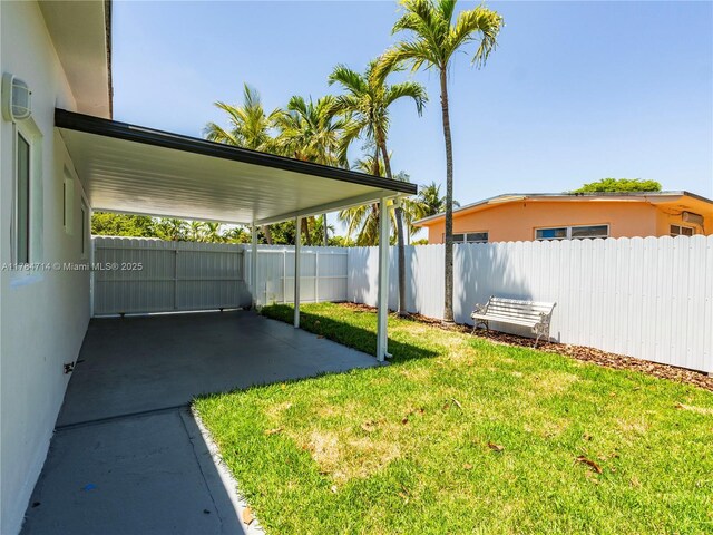 5397 W 14th Ct, Hialeah, FL 33012 - back of house with a yard, a patio, fence, and central AC unit