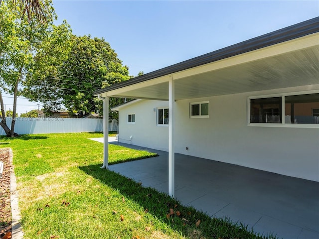 5397 W 14th Ct, Hialeah, FL 33012 - view of yard featuring a patio, fence, and an attached carport
