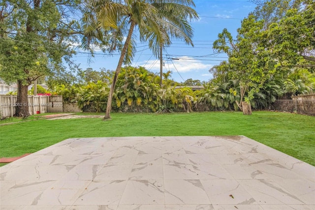 view of patio / terrace featuring fence