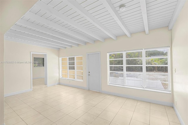 unfurnished sunroom with beam ceiling