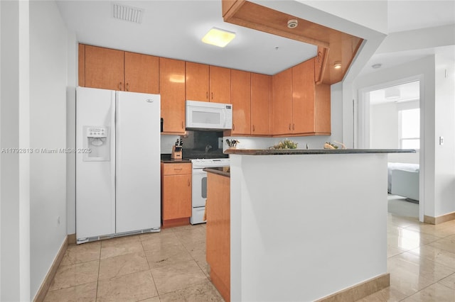 801 Brickell Key Blvd Unit 3105, Miami, FL 33131 - kitchen featuring visible vents, dark countertops, white appliances, baseboards, and light tile patterned floors