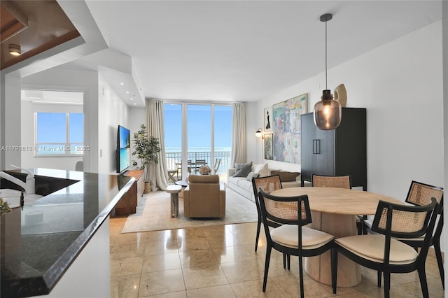 801 Brickell Key Blvd Unit 3105, Miami, FL 33131 - dining space featuring a healthy amount of sunlight and a wall of windows