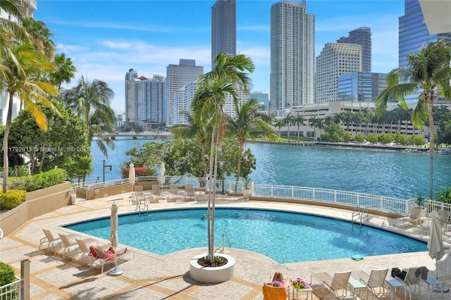 801 Brickell Key Blvd Unit 3105, Miami, FL 33131 - pool featuring a patio, a water view, fence, and a city view