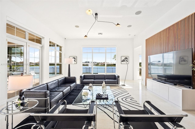 4991 E Sterling Ranch Cir, Davie, FL 33314 - living area featuring a water view and tile patterned flooring