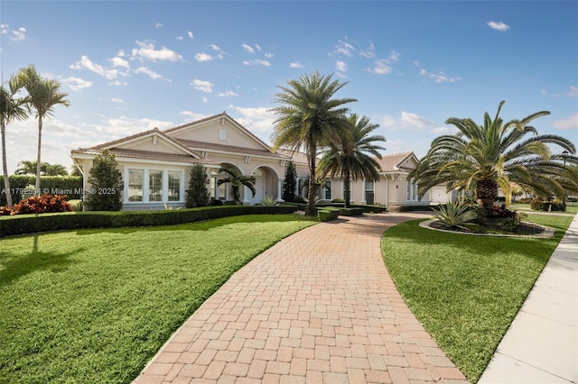 4991 E Sterling Ranch Cir, Davie, FL 33314 - view of front of property featuring a front lawn and curved driveway
