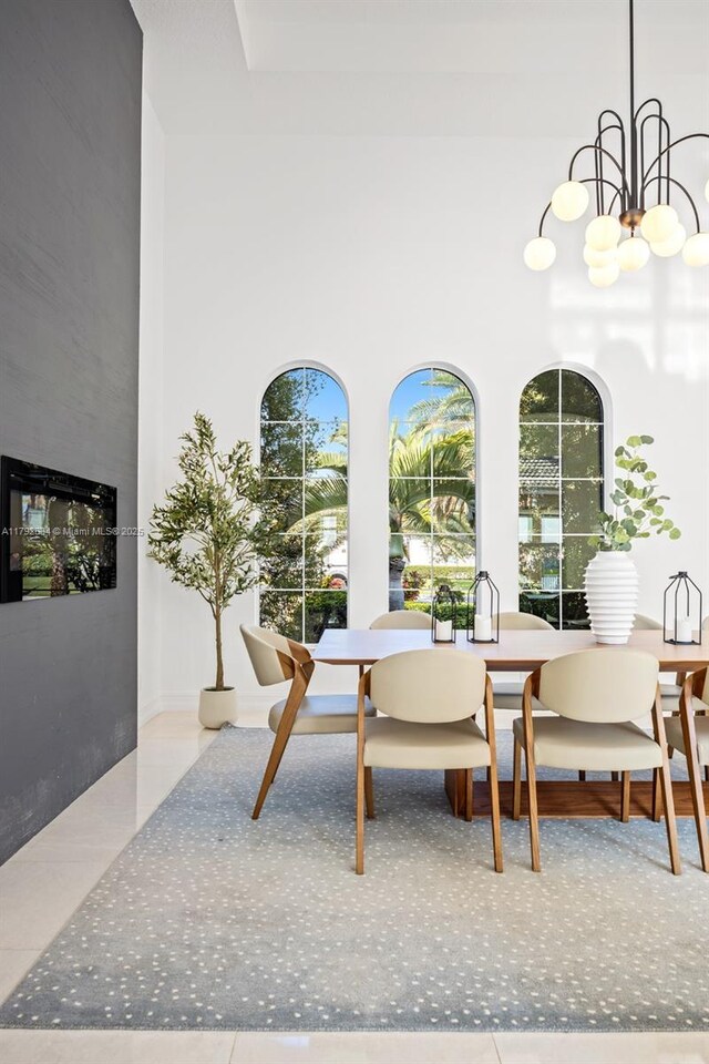 4991 E Sterling Ranch Cir, Davie, FL 33314 - dining area featuring a chandelier and a high ceiling