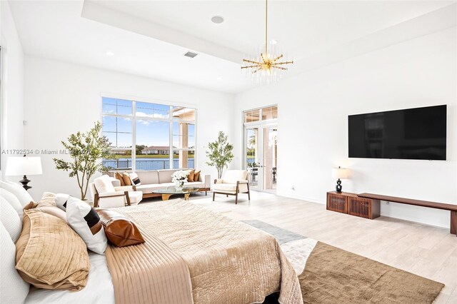 4991 E Sterling Ranch Cir, Davie, FL 33314 - bedroom featuring a chandelier, wood finished floors, recessed lighting, baseboards, and a tray ceiling