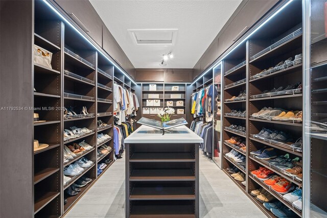 4991 E Sterling Ranch Cir, Davie, FL 33314 - walk in closet featuring attic access