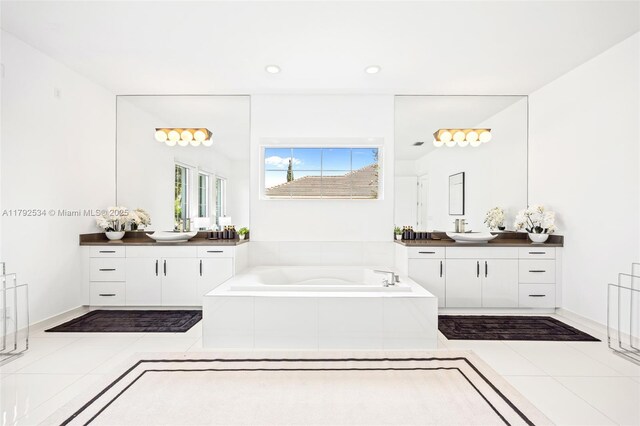 4991 E Sterling Ranch Cir, Davie, FL 33314 - bathroom with a garden tub, two vanities, recessed lighting, and tile patterned floors