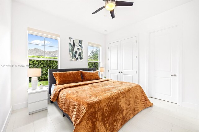 4991 E Sterling Ranch Cir, Davie, FL 33314 - bedroom featuring a closet, baseboards, ceiling fan, and light tile patterned floors