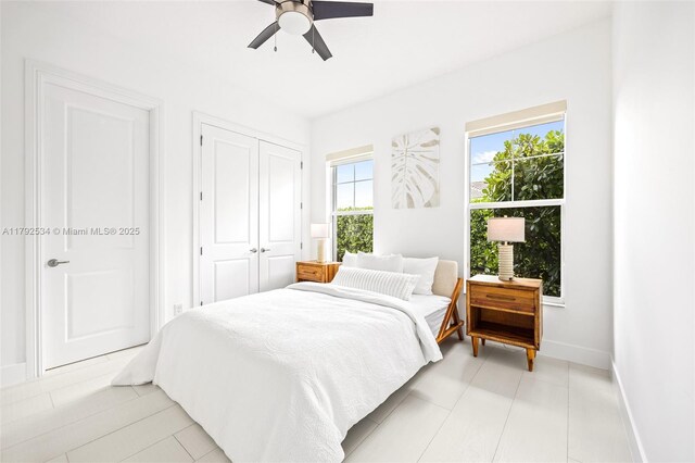4991 E Sterling Ranch Cir, Davie, FL 33314 - bedroom with baseboards, a closet, and a ceiling fan