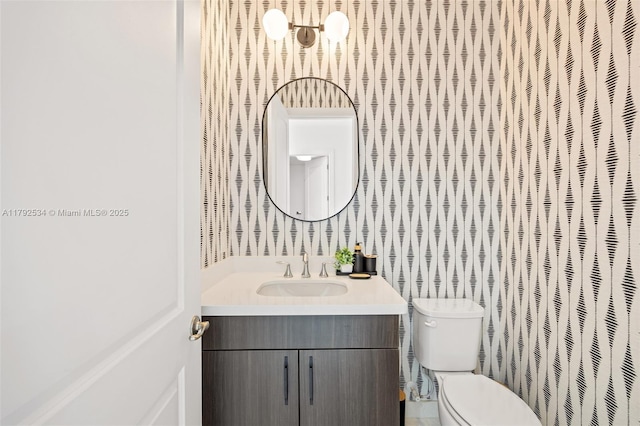4991 E Sterling Ranch Cir, Davie, FL 33314 - bathroom with vanity, toilet, and wallpapered walls