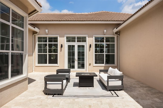 4991 E Sterling Ranch Cir, Davie, FL 33314 - view of patio / terrace with french doors and an outdoor living space with a fire pit