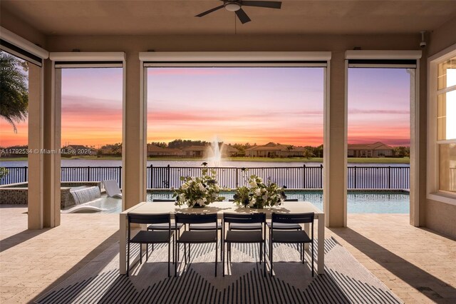 4991 E Sterling Ranch Cir, Davie, FL 33314 - sunroom featuring a water view