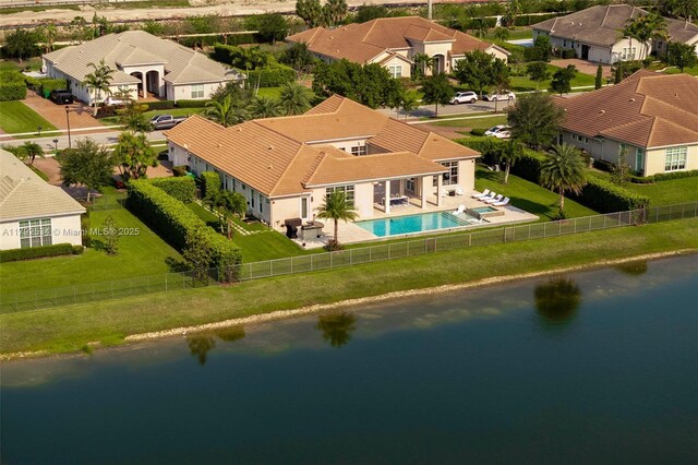 4991 E Sterling Ranch Cir, Davie, FL 33314 - aerial view of residential area with a nearby body of water and a pool area