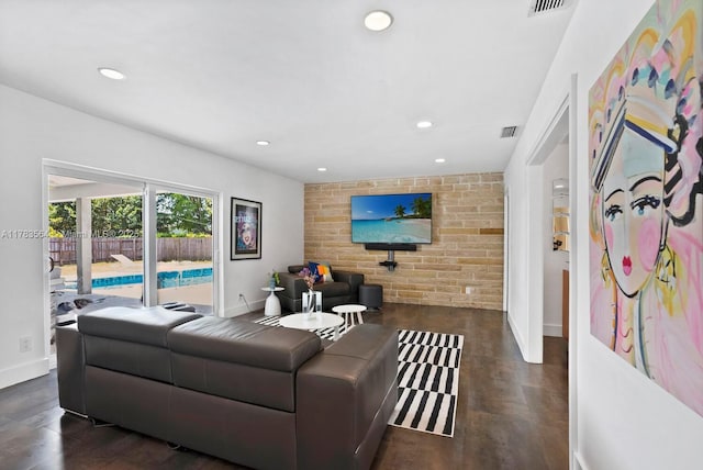 13605 SW 73rd Ave, Palmetto Bay, FL 33158 - living room featuring an accent wall, baseboards, recessed lighting, wood finished floors, and brick wall