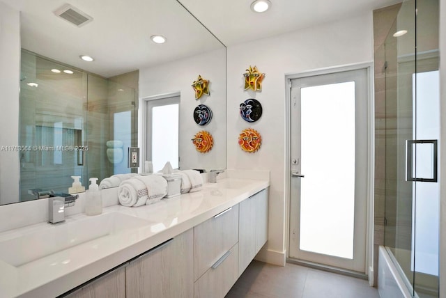 13605 SW 73rd Ave, Palmetto Bay, FL 33158 - full bathroom with a shower with shower door, double vanity, tile patterned floors, and recessed lighting
